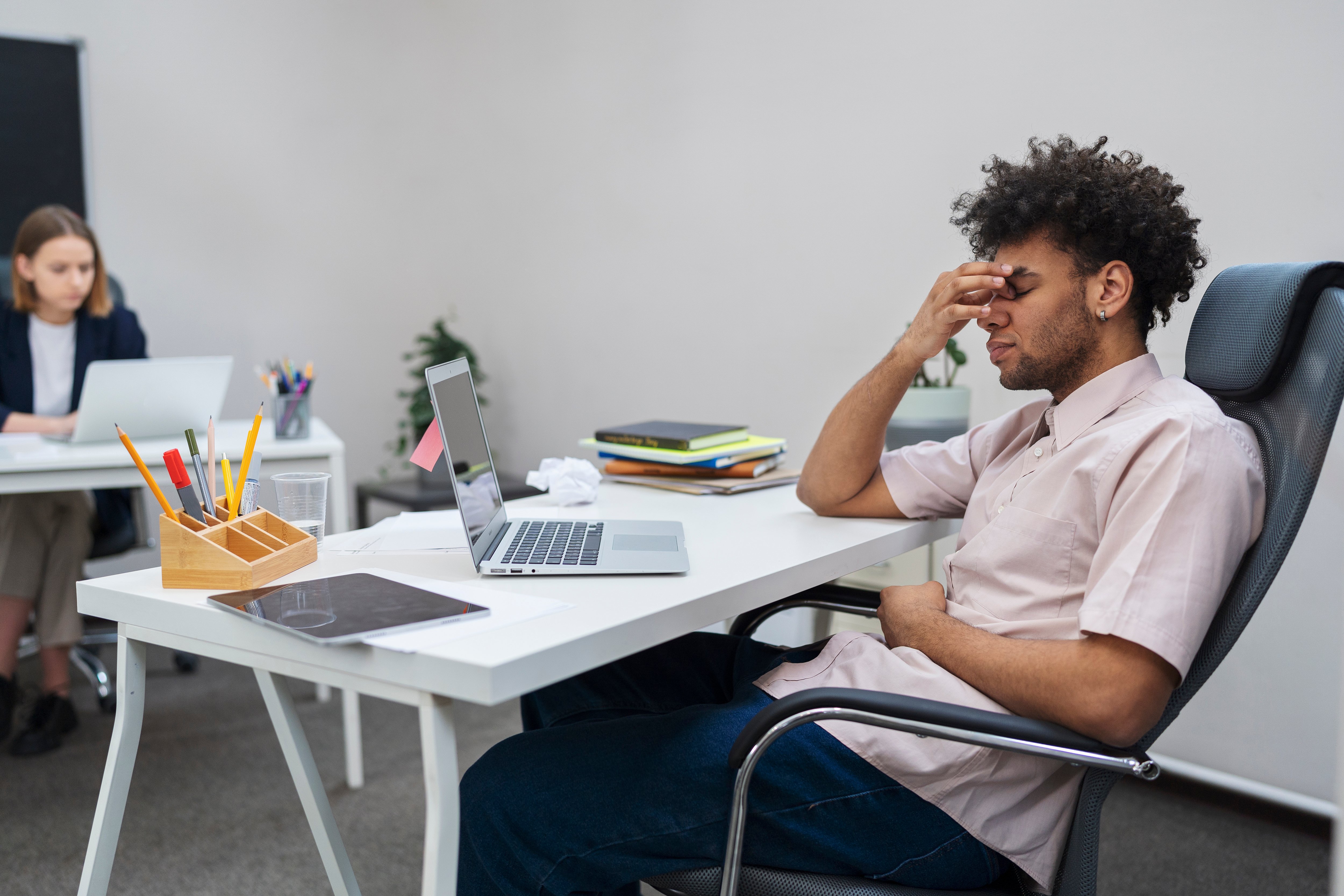 medium-shot-tired-man-with-laptop-work